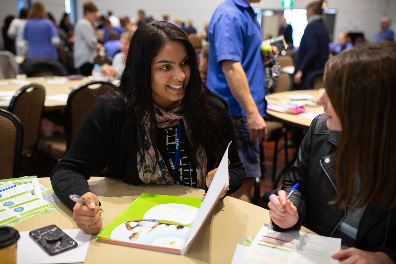 Image of two women speaking